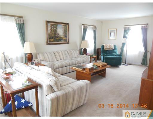 29 Hughes Road Somerset, NJ 08873 - Photo 5 of 19 a living room with furniture and a window