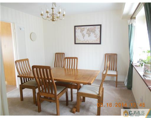 29 Hughes Road Somerset, NJ 08873 - Photo 6 of 19 a view of a dining room with furniture and a window