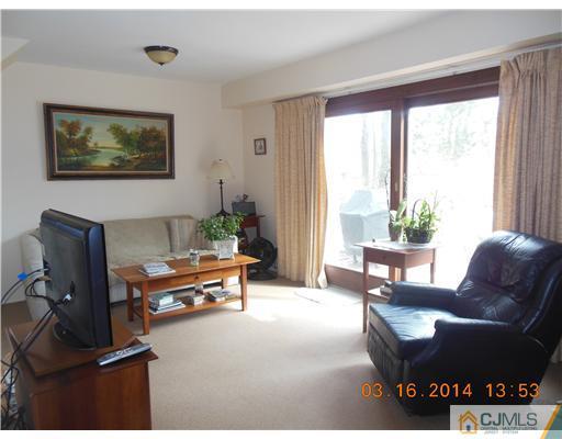 29 Hughes Road Somerset, NJ 08873 - Photo 7 of 19 a living room with furniture and a window