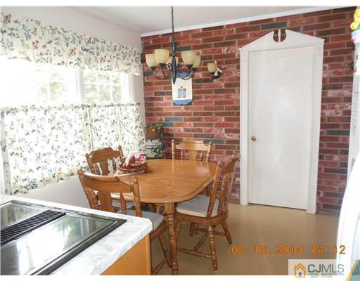 29 Hughes Road Somerset, NJ 08873 - Photo 10 of 19 a balcony with table and chairs