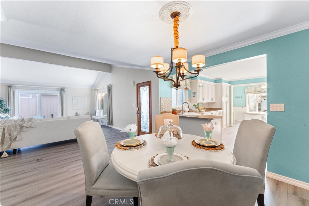 2529 Shadow Santa Ana, CA 92705 - Photo 12 of 45 a view of a dining room with furniture wooden floor and chandelier