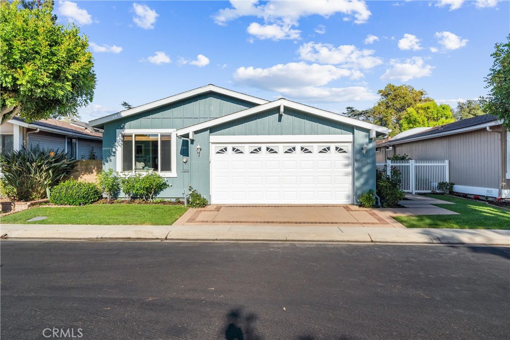 2529 Shadow Santa Ana, CA 92705 - Photo 2 of 45 a front view of house with yard and green space