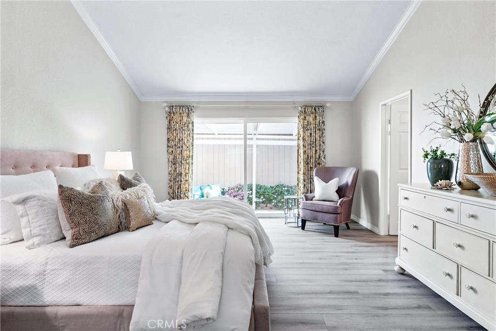 2529 Shadow Santa Ana, CA 92705 - Photo 24 of 45 a bedroom with a bed and furniture with window