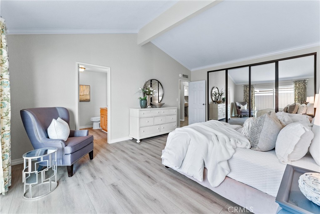 2529 Shadow Santa Ana, CA 92705 - Photo 26 of 45 a spacious bedroom with a bed and window