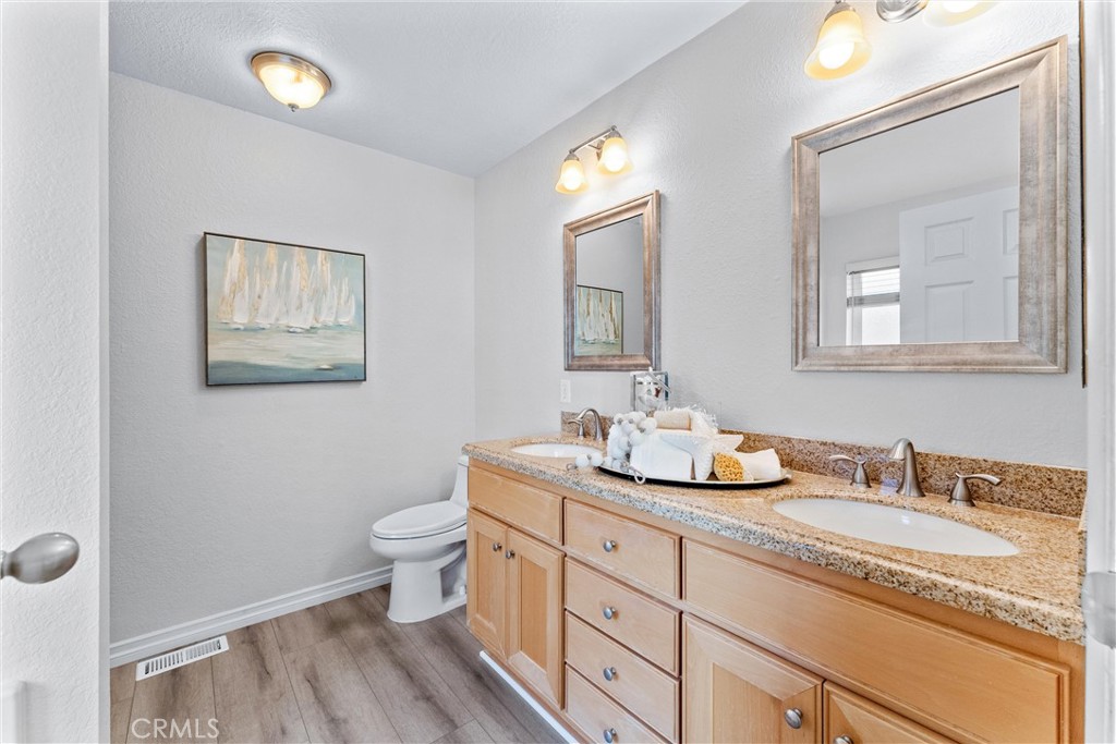 2529 Shadow Santa Ana, CA 92705 - Photo 27 of 45 a bathroom with double sink and a mirror