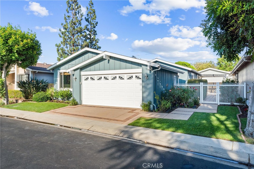 2529 Shadow Santa Ana, CA 92705 - Photo 3 of 45 a front view of a house with a yard and potted plants