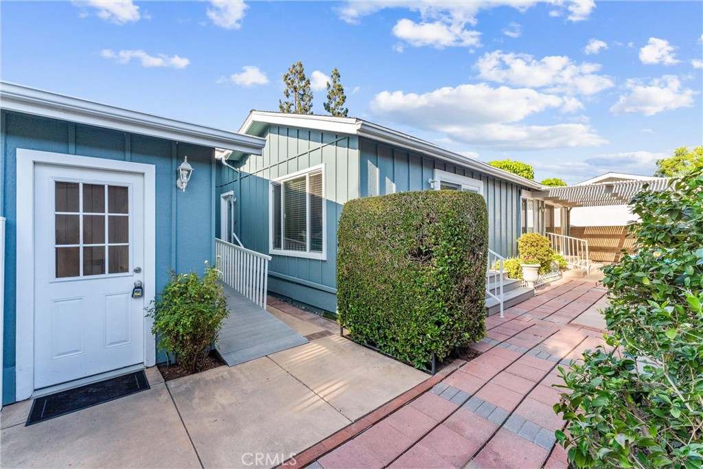 2529 Shadow Santa Ana, CA 92705 - Photo 4 of 45 a front view of a house with garden