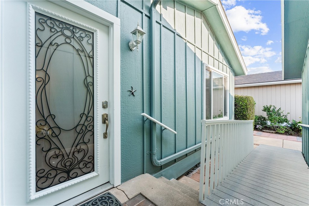 2529 Shadow Santa Ana, CA 92705 - Photo 5 of 45 an entryway with wooden floor and windows