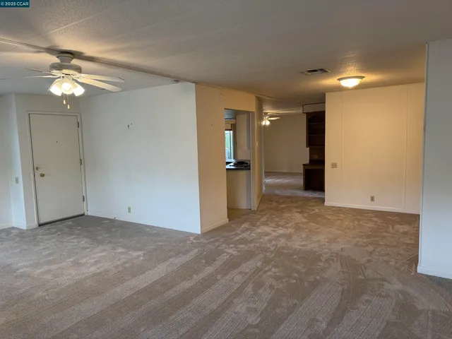 a view of an empty room with a bathroom