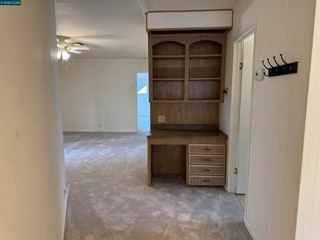 a view of an empty room and fire place