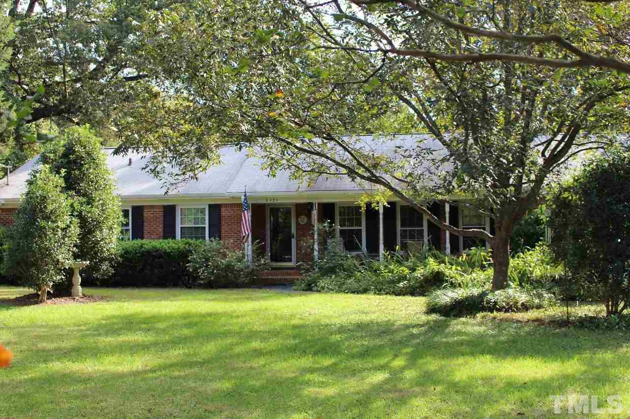 6424 Litchford Road Raleigh, NC 27615 - Photo 1 of 8 a front view of a house with a garden