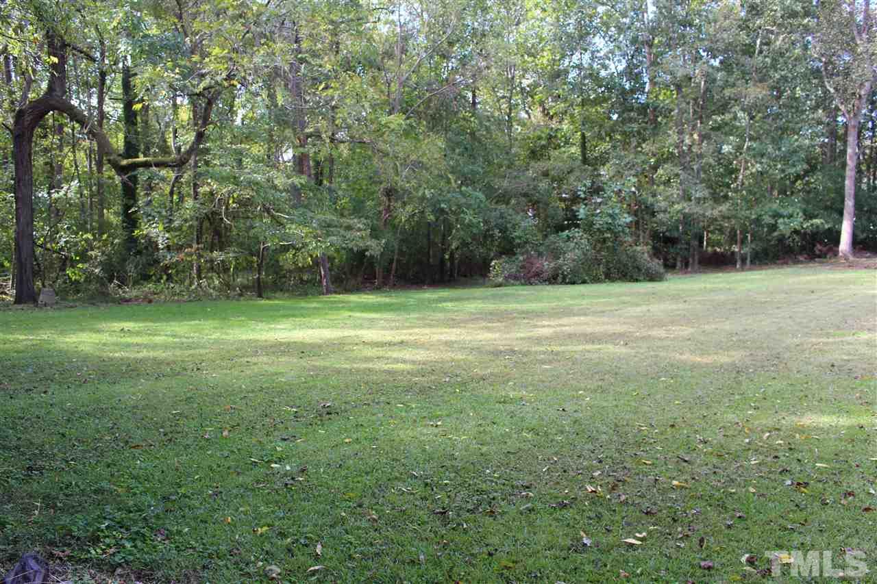 6424 Litchford Road Raleigh, NC 27615 - Photo 5 of 8 a view of a field with a trees in the background