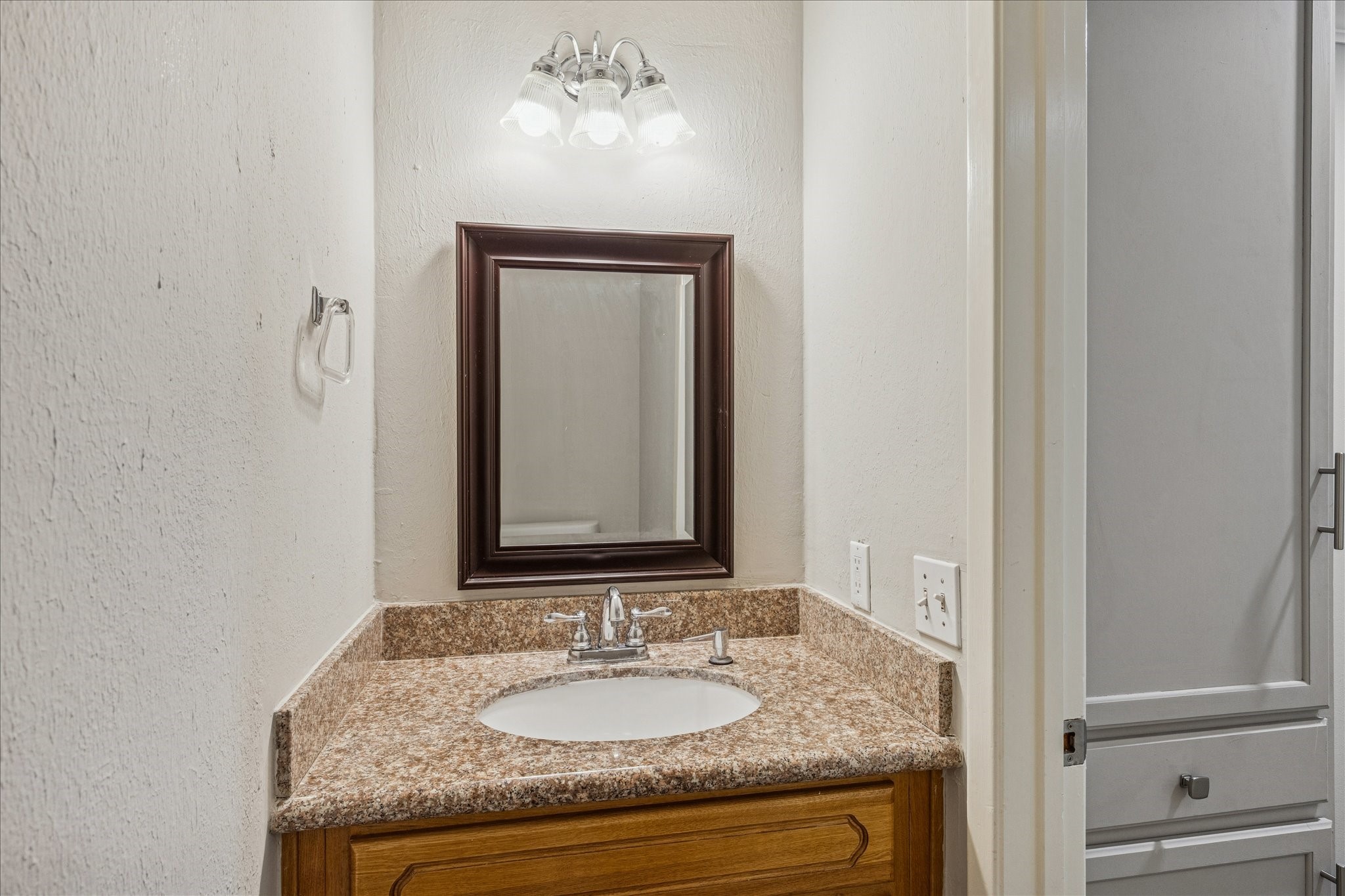 1615 Prairie Mark Lane Houston, TX 77077 - Photo 14 of 25 And this is the half bath. To the right outside of the door - across from the washer and dryer - is more storage.