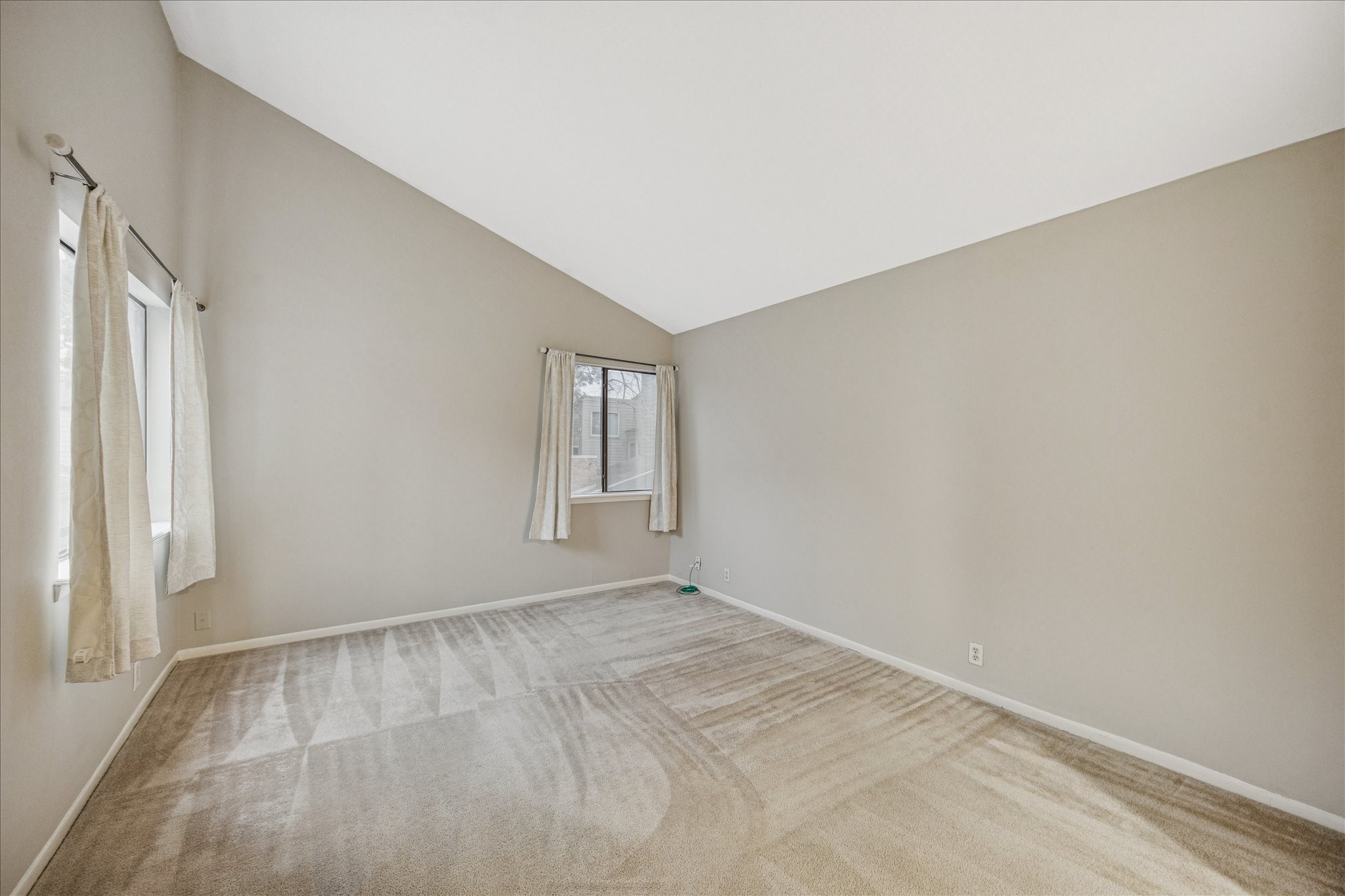 1615 Prairie Mark Lane Houston, TX 77077 - Photo 17 of 25 Past the secondary bedroom at the end of the hallway is the primary bedroom. Behind and to the right are the closets and ensuite bathroom. Carpet just professionally cleaned.