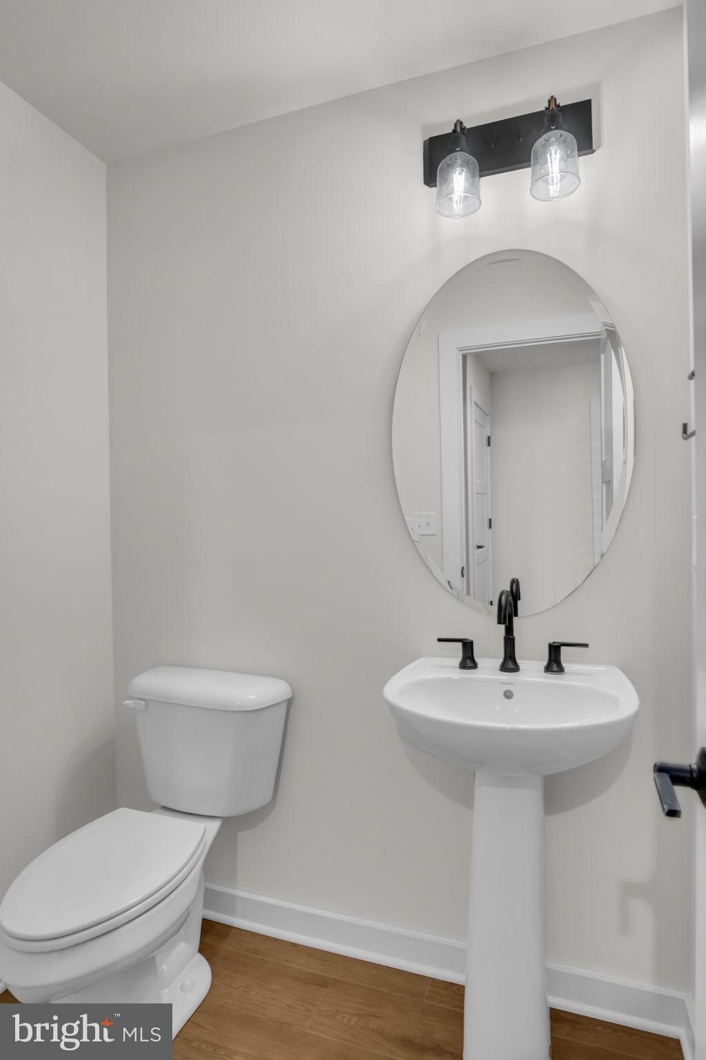 1012 Blackstone Run Carlisle, PA 17015 - Photo 11 of 13 a bathroom with a toilet sink and mirror