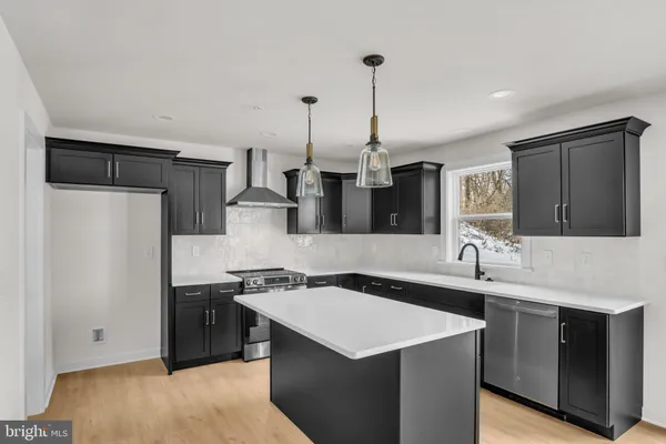 a kitchen with a sink a refrigerator and a sink