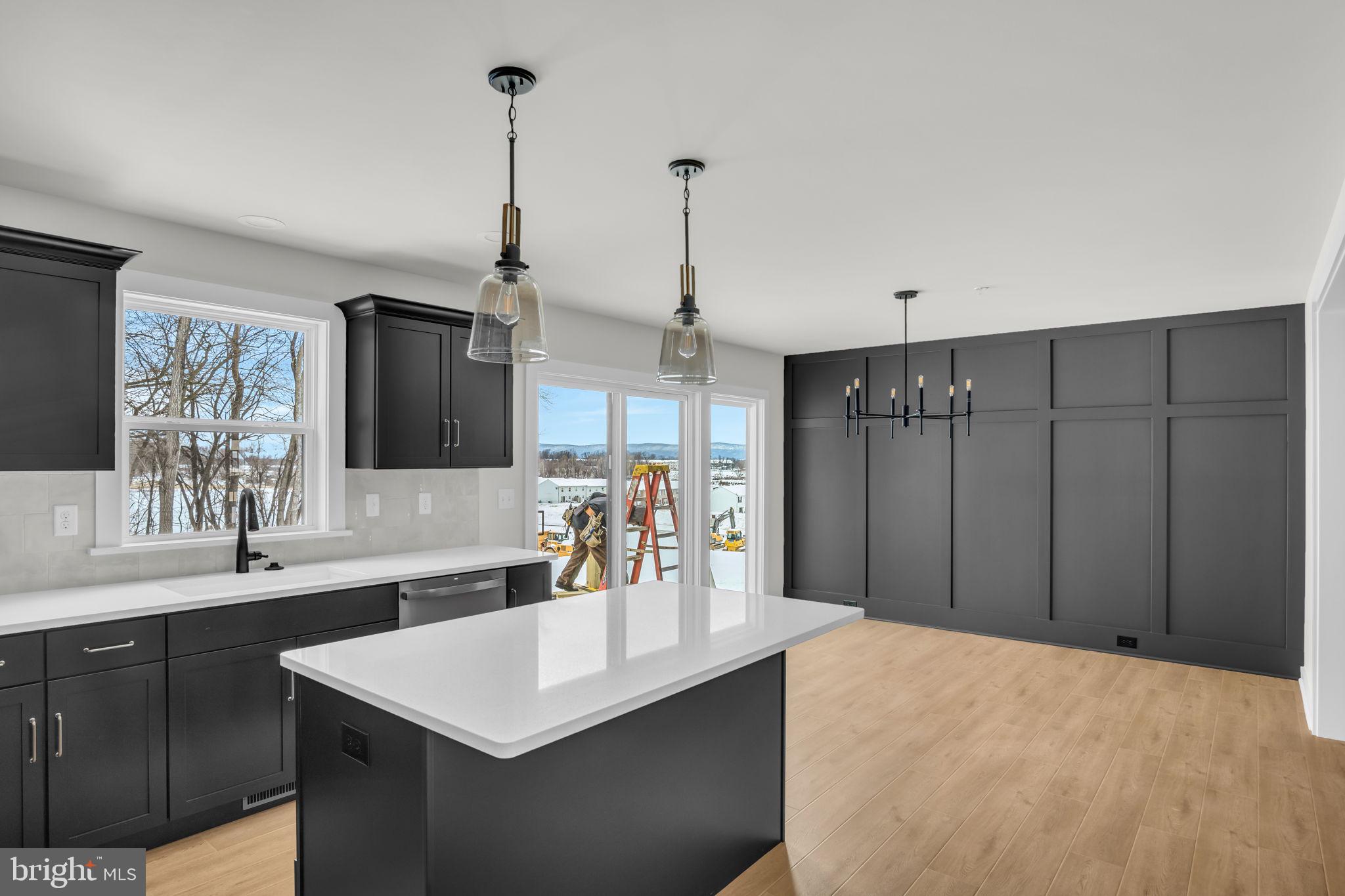 1012 Blackstone Run Carlisle, PA 17015 - Photo 4 of 13 a kitchen with stainless steel appliances kitchen island a sink stove and refrigerator