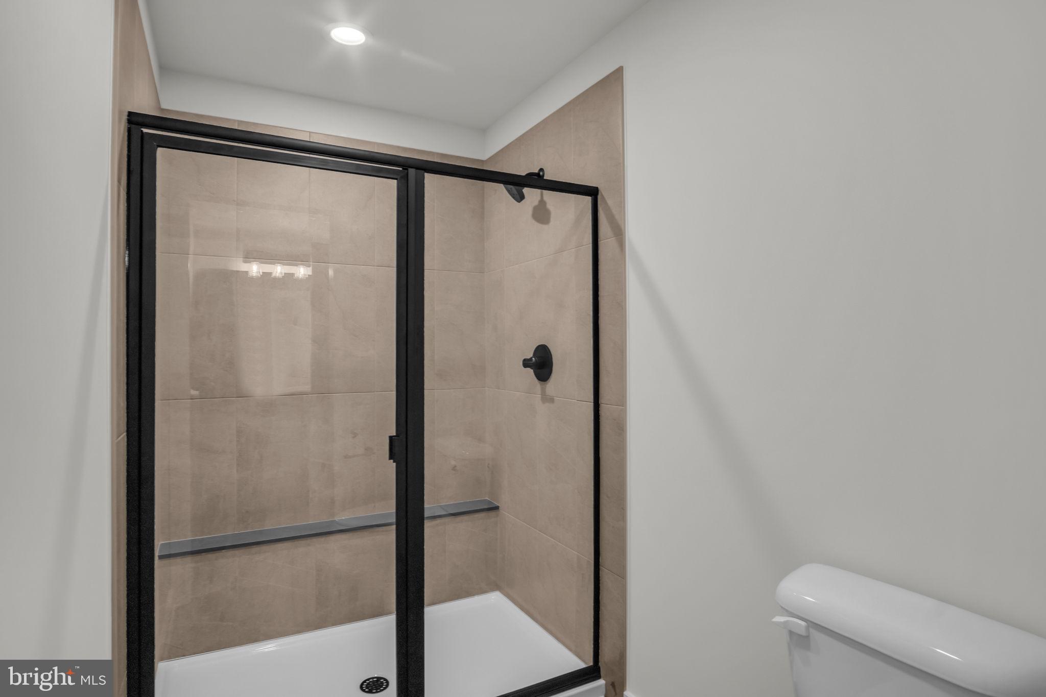 1012 Blackstone Run Carlisle, PA 17015 - Photo 9 of 13 a bathroom with a glass shower door