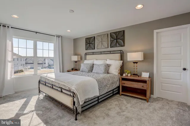 a bed room with a bed and a window