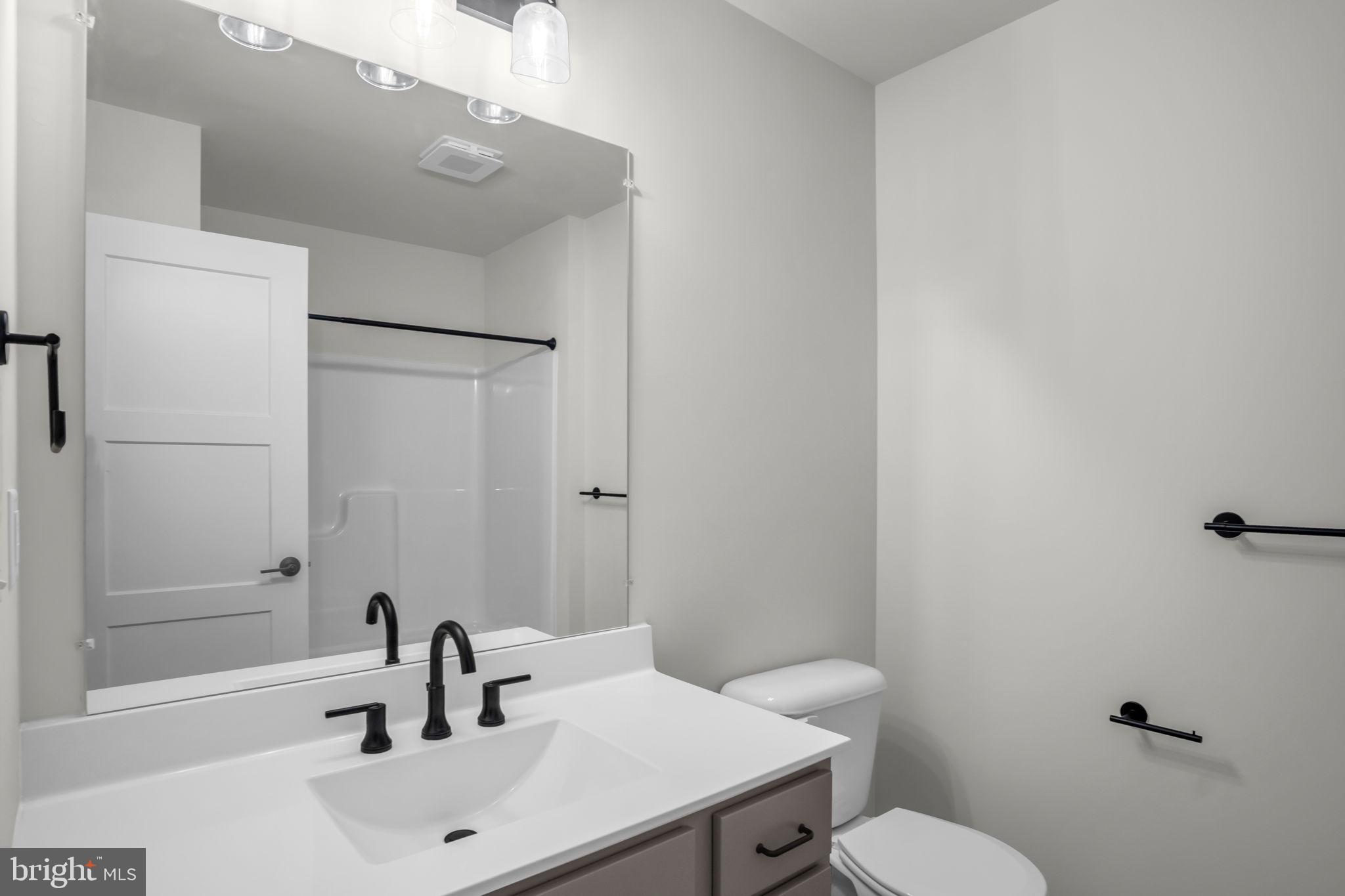 1012 Blackstone Run Carlisle, PA 17015 - Photo 10 of 13 a bathroom with a sink a toilet and shower