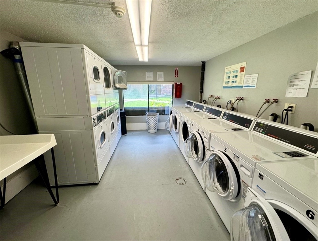 1186 Worcester Road, Unit 720 Framingham, MA 01702 - Photo 12 of 15 a utility room with dryer and washer