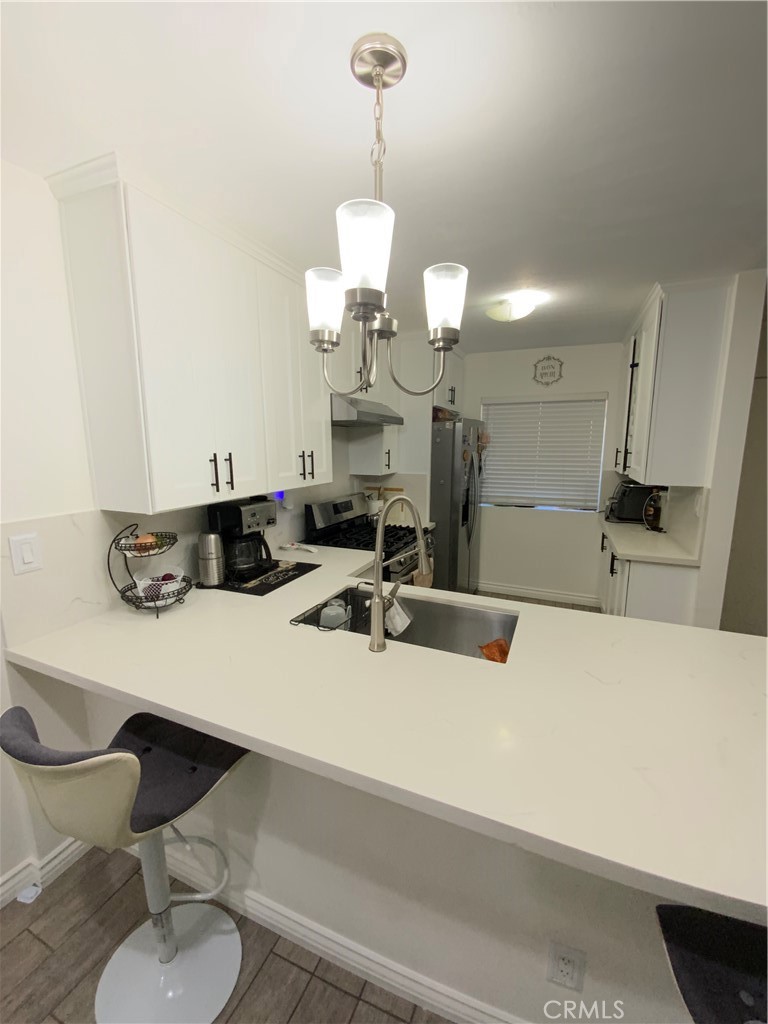 4140 Workman Mill Road, Unit 172 Whittier, CA 90601 - Photo 7 of 21 a large kitchen with a table and chairs
