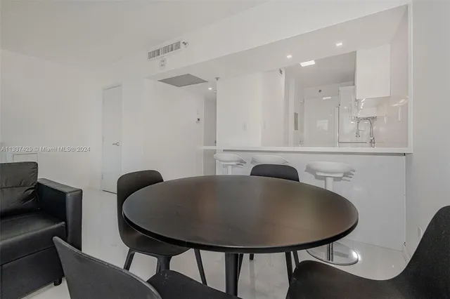 a bathroom with a sink a mirror and a toilet