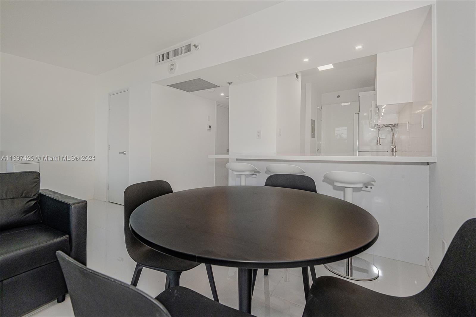 100 Lincoln Road, Unit 519 Miami Beach, FL 33139 - Photo 7 of 15 a bathroom with a sink a mirror and a toilet