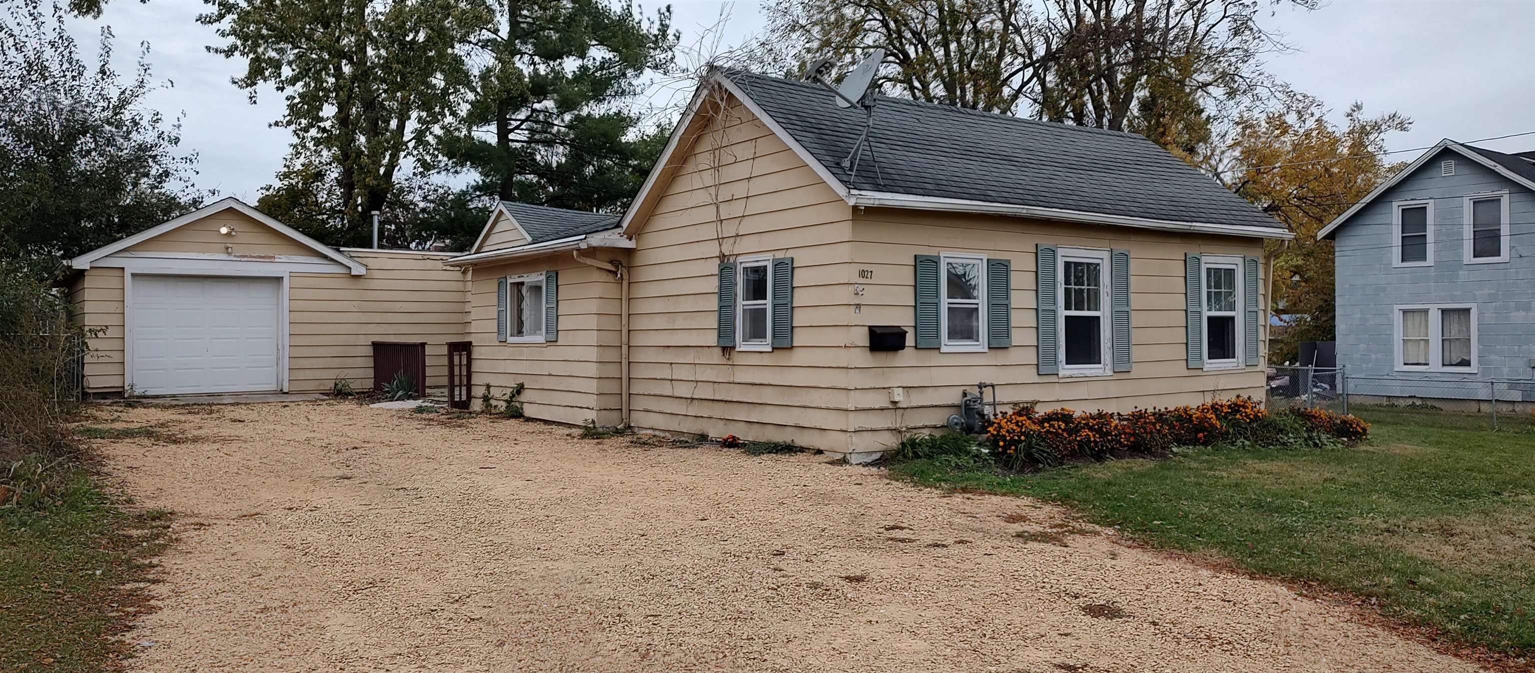 1027 Garfield Avenue Belvidere, IL 61008 - Photo 1 of 21 a view of a house with a yard and large tree