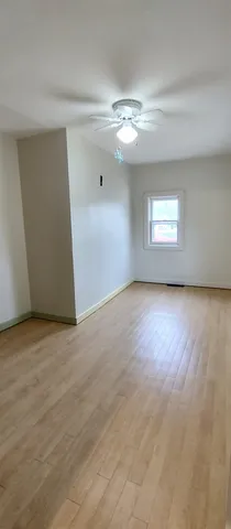 an empty room with a empty space and windows
