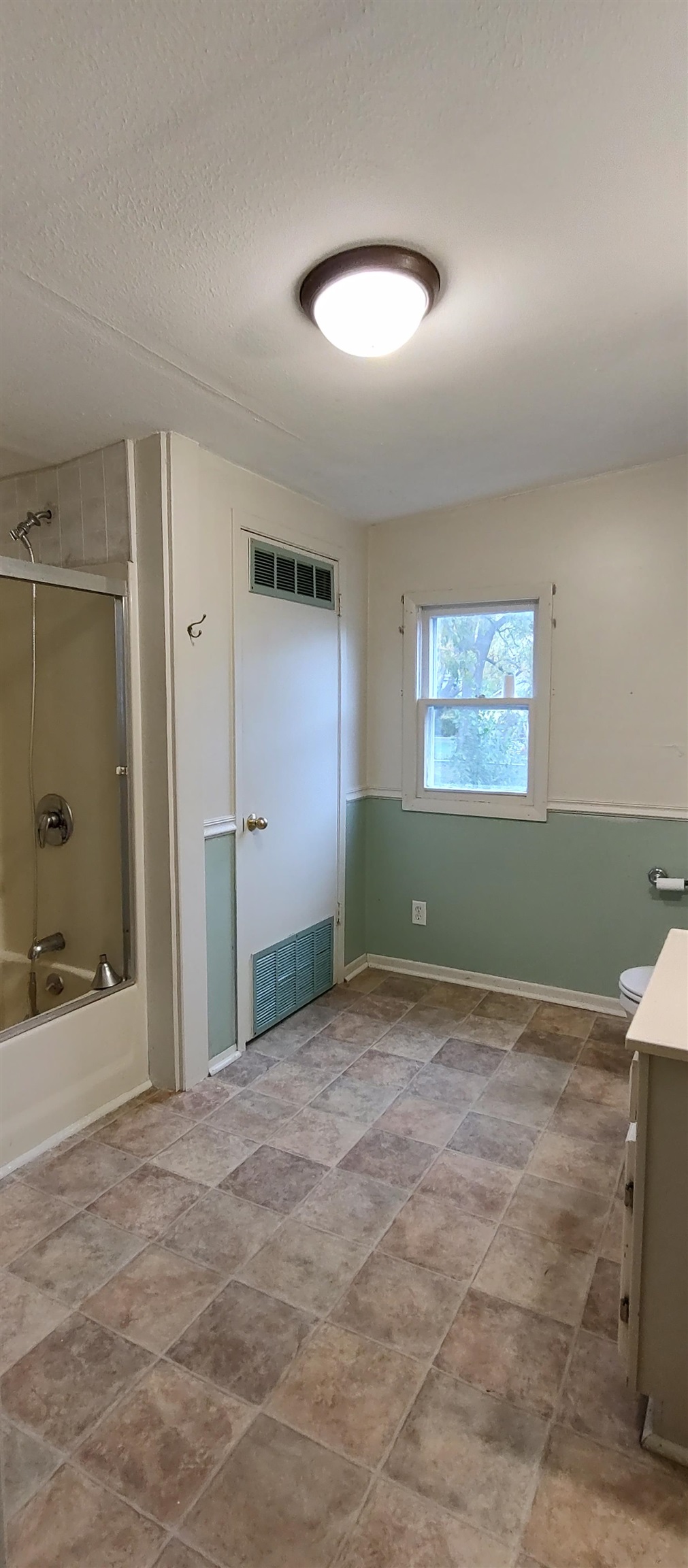 1027 Garfield Avenue Belvidere, IL 61008 - Photo 21 of 21 a view of a bathroom with a tub shower and sink