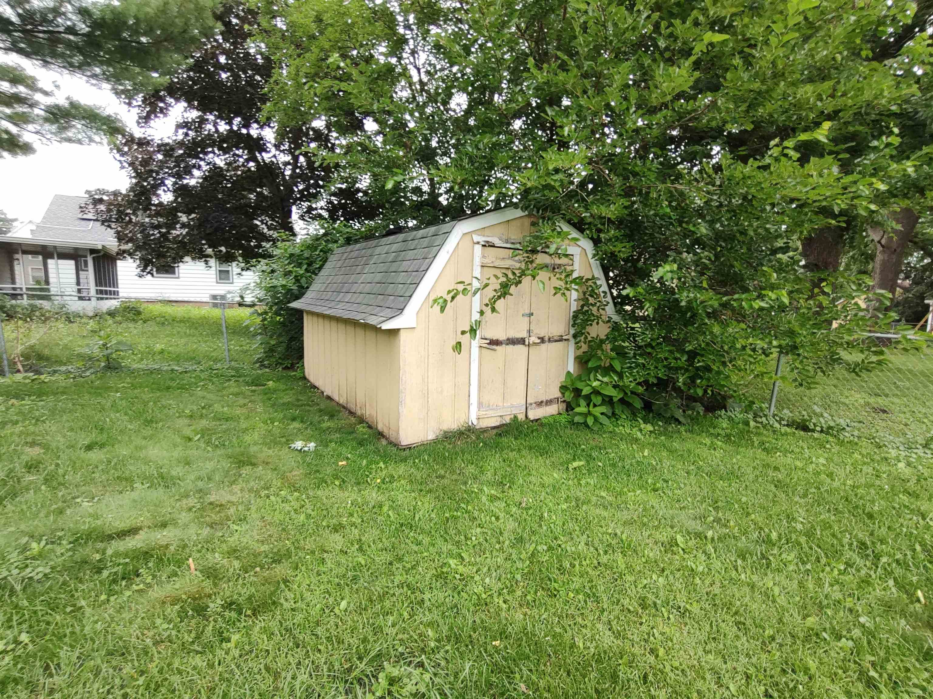 1027 Garfield Avenue Belvidere, IL 61008 - Photo 8 of 21 a view of a house with a backyard