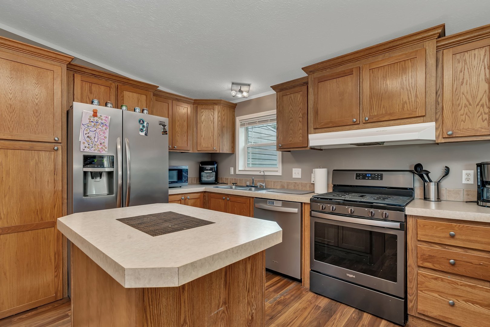2389 East 29th Road Seneca, IL 61360 - Photo 14 of 46 a kitchen with a stove a sink and a refrigerator
