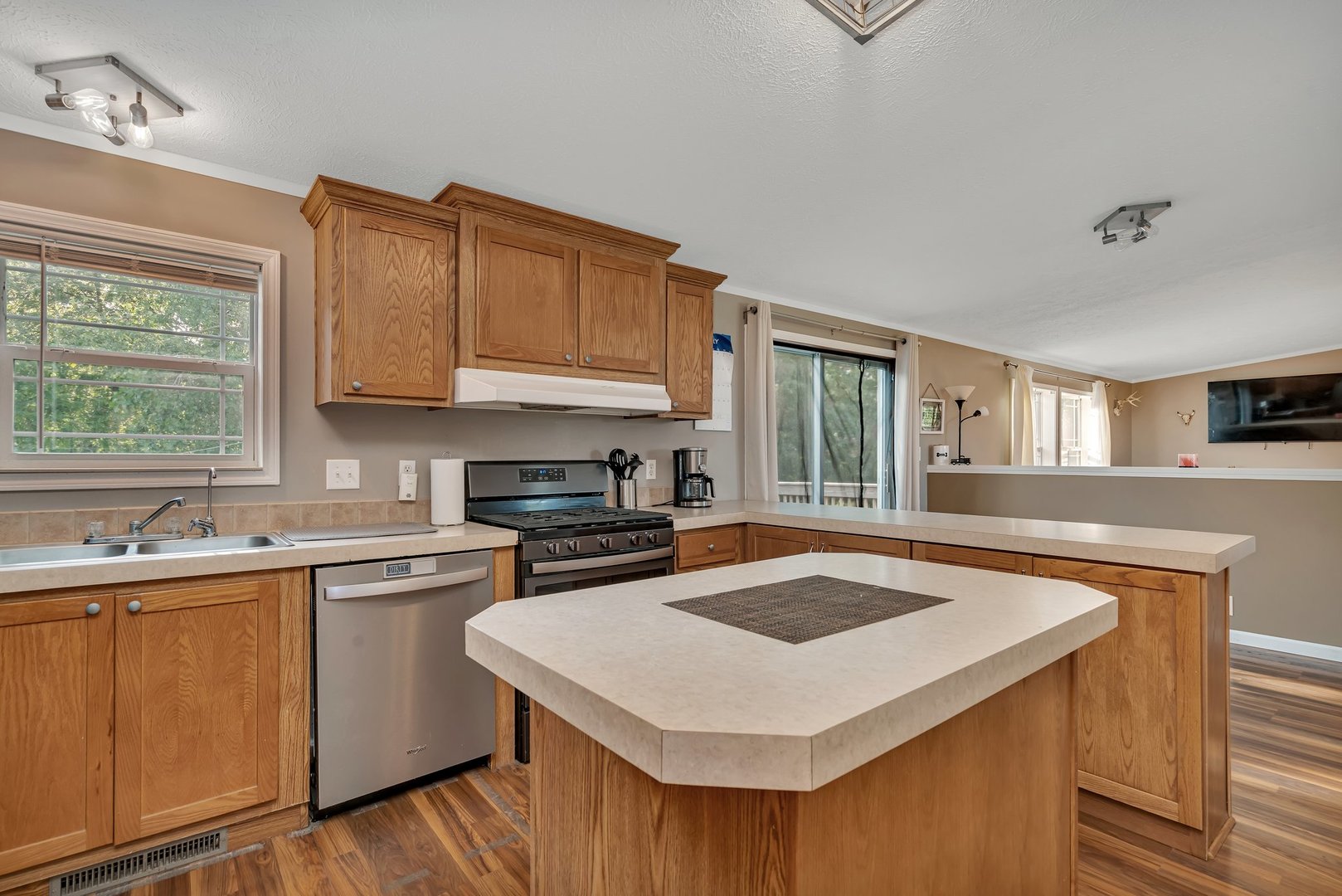 2389 East 29th Road Seneca, IL 61360 - Photo 16 of 46 a kitchen with stainless steel appliances a sink a stove a refrigerator cabinets and a window