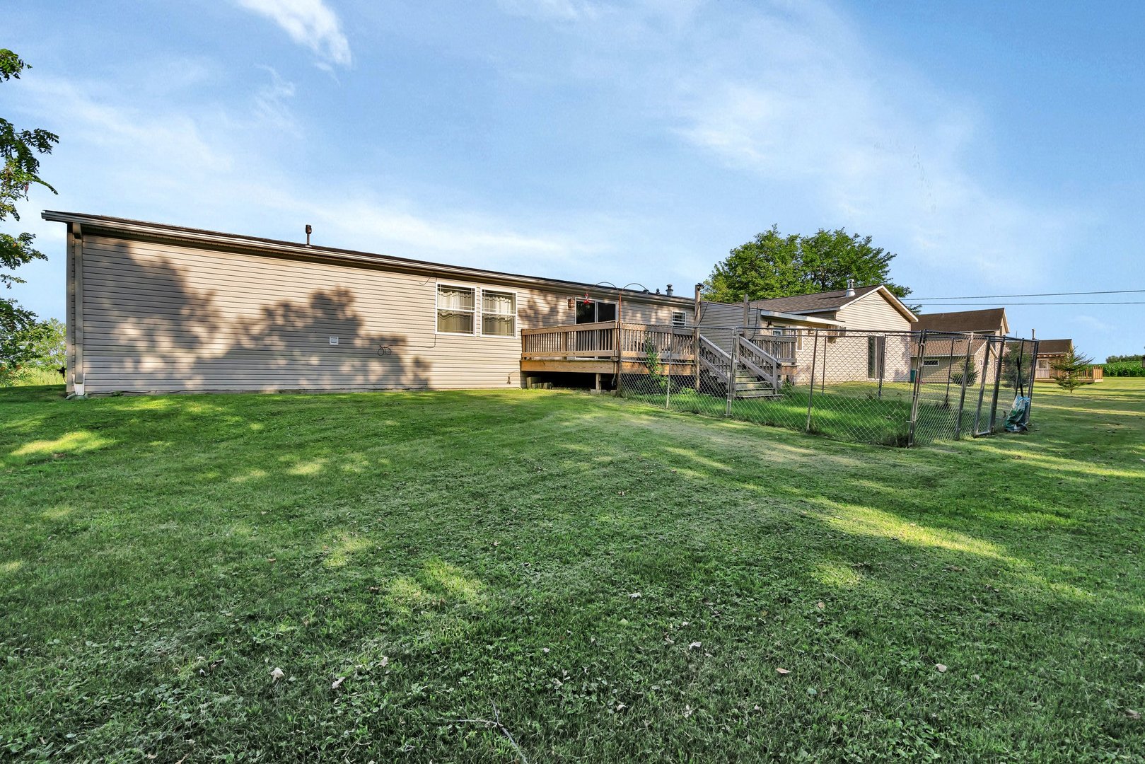 2389 East 29th Road Seneca, IL 61360 - Photo 35 of 46 a view of a house with a yard and a garden
