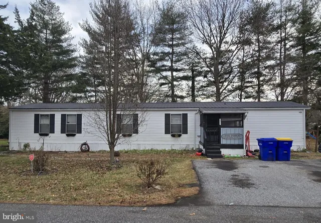 a front view of house with yard and seating area