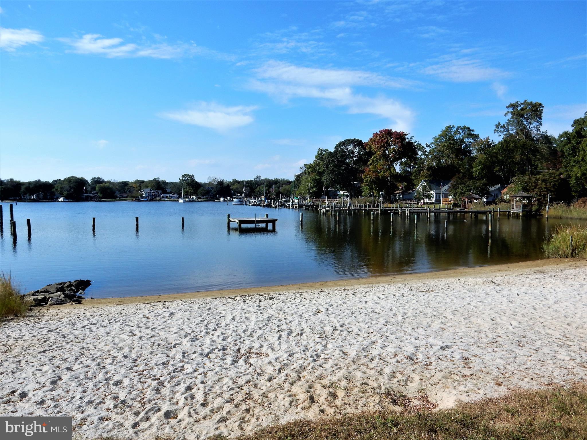 306 Oakwood Road Edgewater, MD 21037 - Photo 32 of 36 a view of a lake with houses in the back