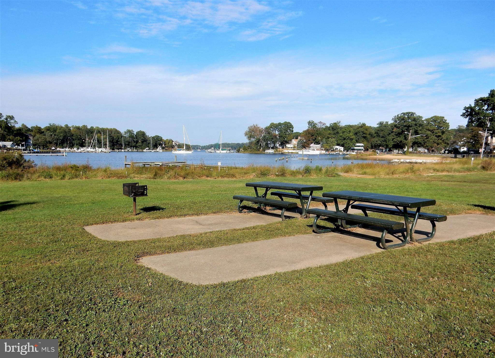 306 Oakwood Road Edgewater, MD 21037 - Photo 33 of 36 a view of a lake with a yard