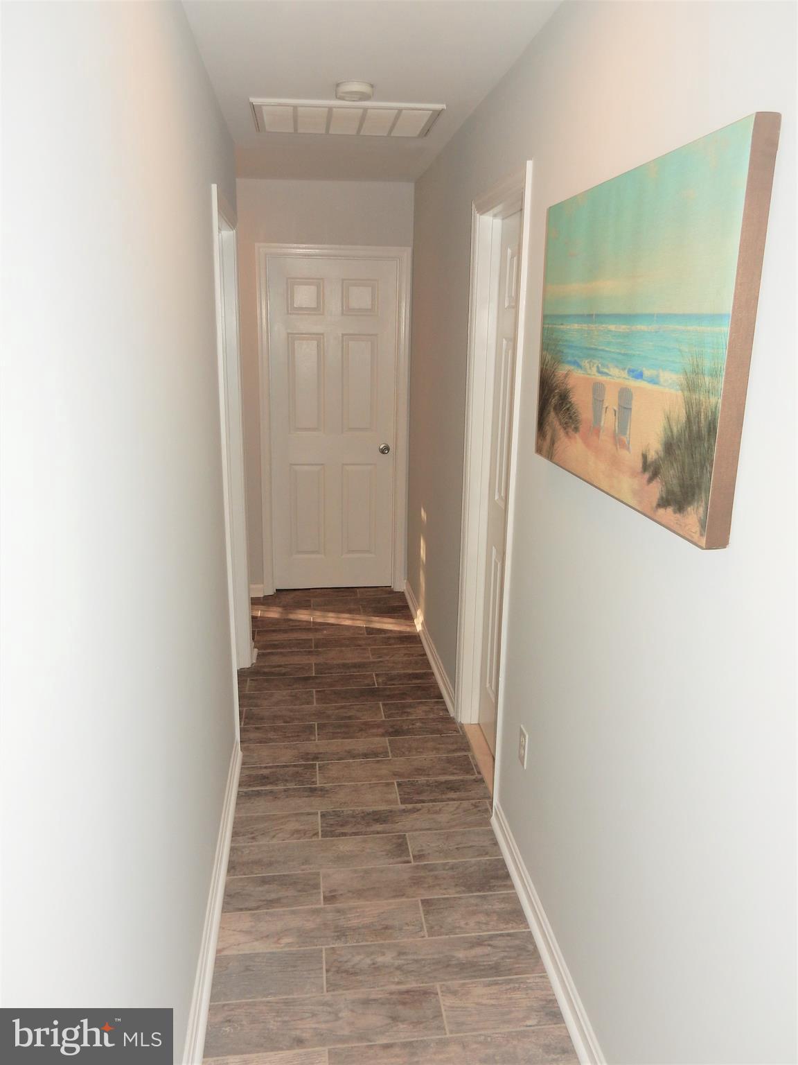 306 Oakwood Road Edgewater, MD 21037 - Photo 7 of 36 a view of a hallway with wooden floor
