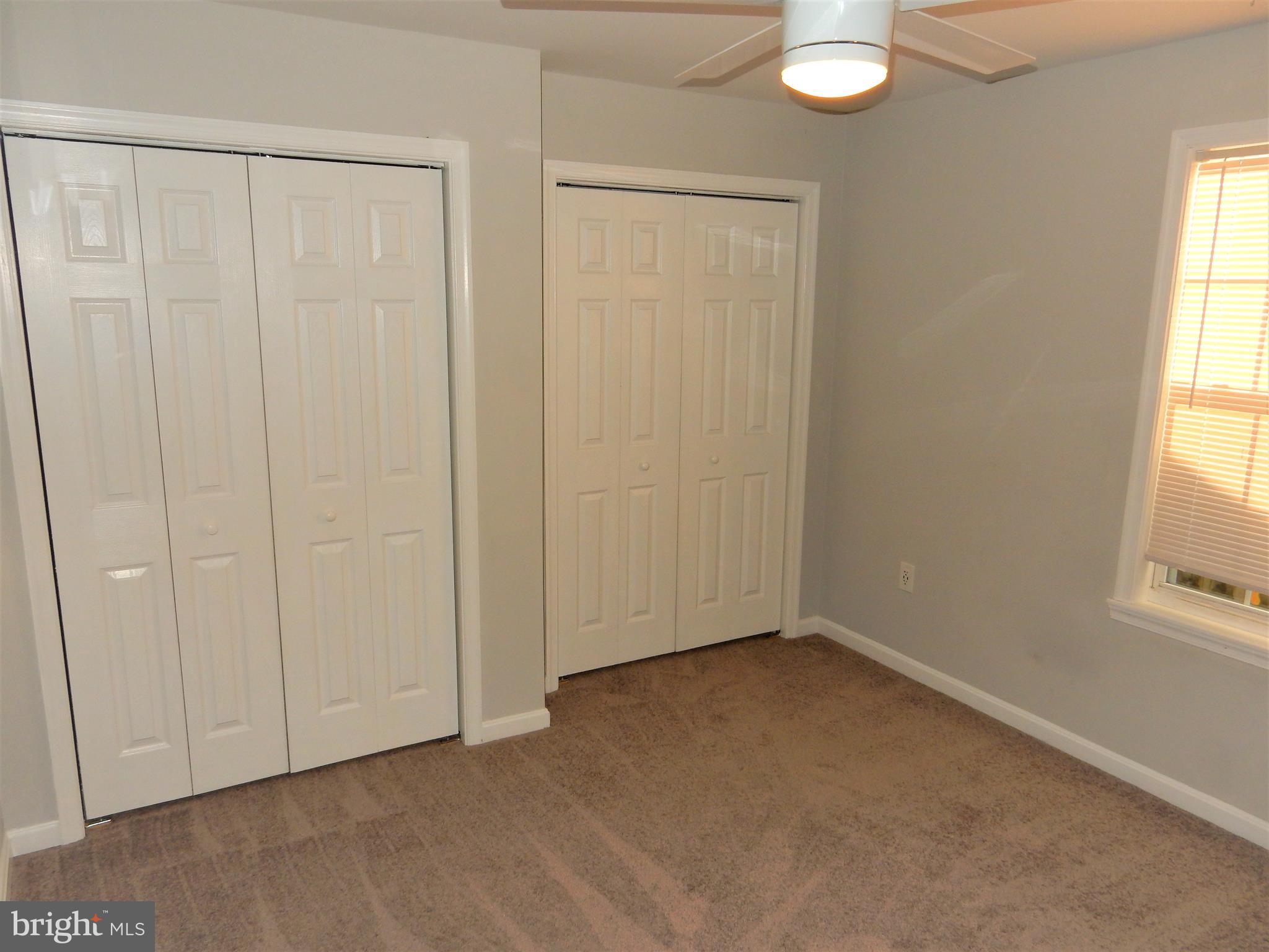 306 Oakwood Road Edgewater, MD 21037 - Photo 8 of 36 an empty room with windows