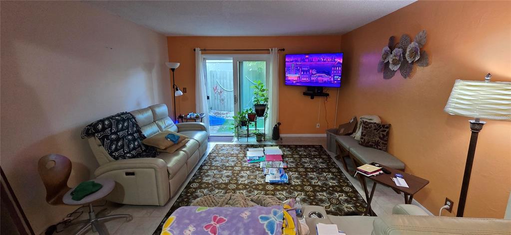 165 Pine Cone Trail Ormond Beach, FL 32174 - Photo 13 of 25 a living room with furniture rug and window