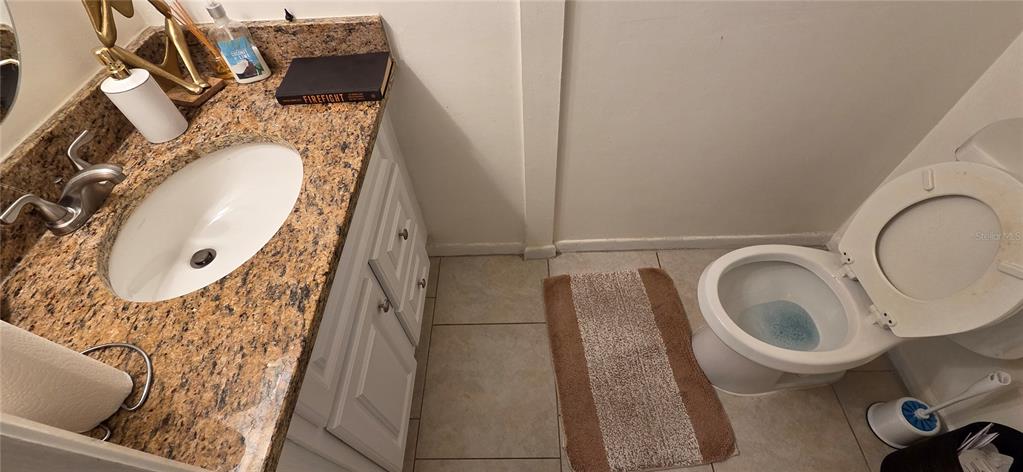 165 Pine Cone Trail Ormond Beach, FL 32174 - Photo 14 of 25 a bathroom with a toilet mirror and tub