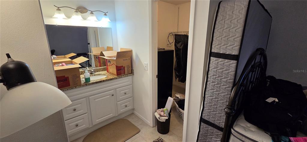 165 Pine Cone Trail Ormond Beach, FL 32174 - Photo 18 of 25 a bathroom with sink and mirror