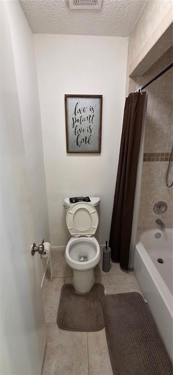 165 Pine Cone Trail Ormond Beach, FL 32174 - Photo 20 of 25 a white toilet sitting next to a bathroom sink and a tub