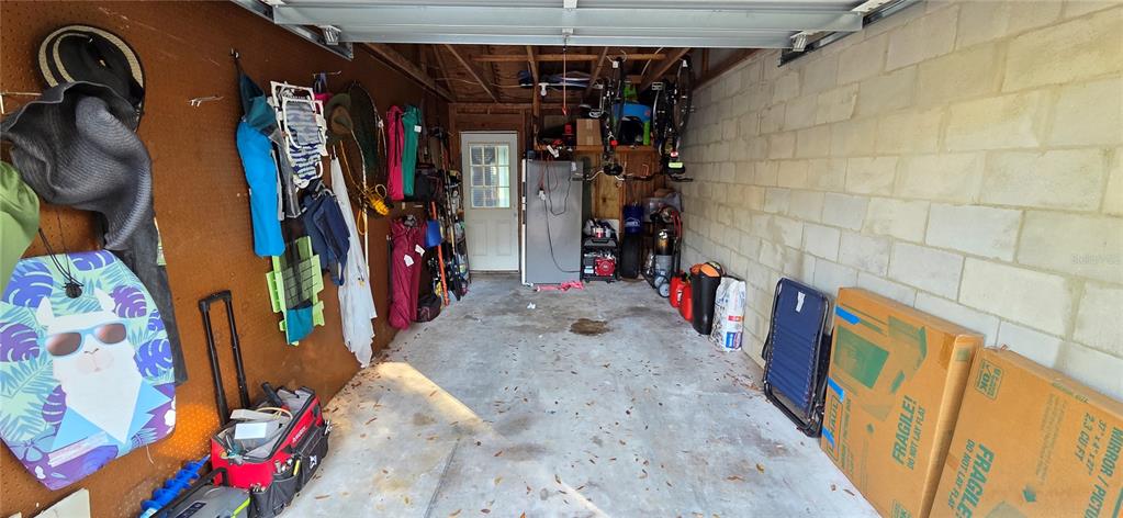 165 Pine Cone Trail Ormond Beach, FL 32174 - Photo 25 of 25 a view of walk in closet with clothes and shoes
