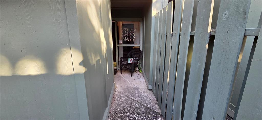 165 Pine Cone Trail Ormond Beach, FL 32174 - Photo 6 of 25 a view of a hallway with wooden floor and a bathroom