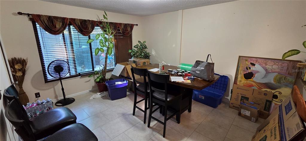 165 Pine Cone Trail Ormond Beach, FL 32174 - Photo 8 of 25 a living room with furniture and a large window