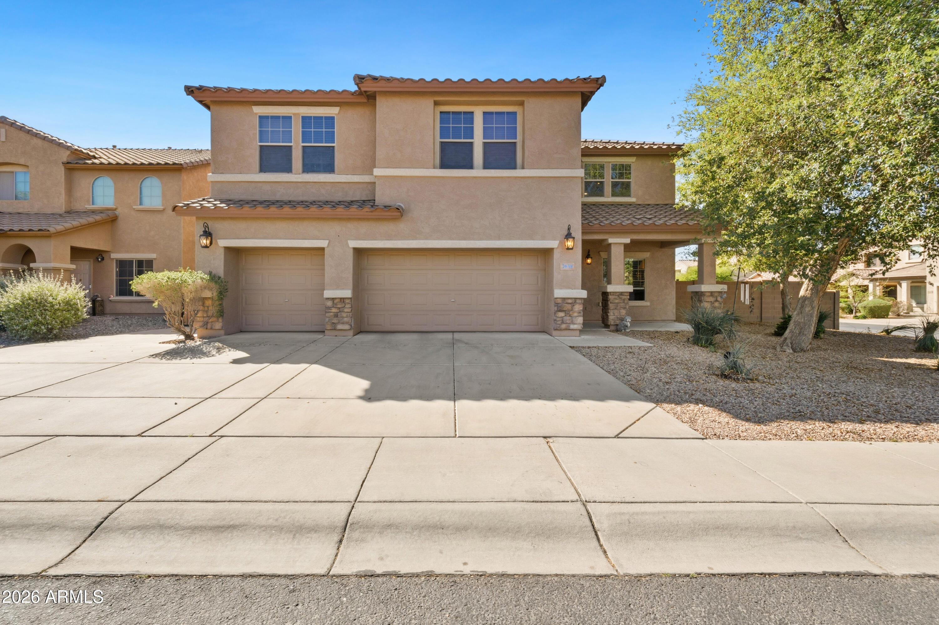 7639 West Georgetown Way Florence, AZ 85132 - Photo 1 of 25 a front view of a house with a yard