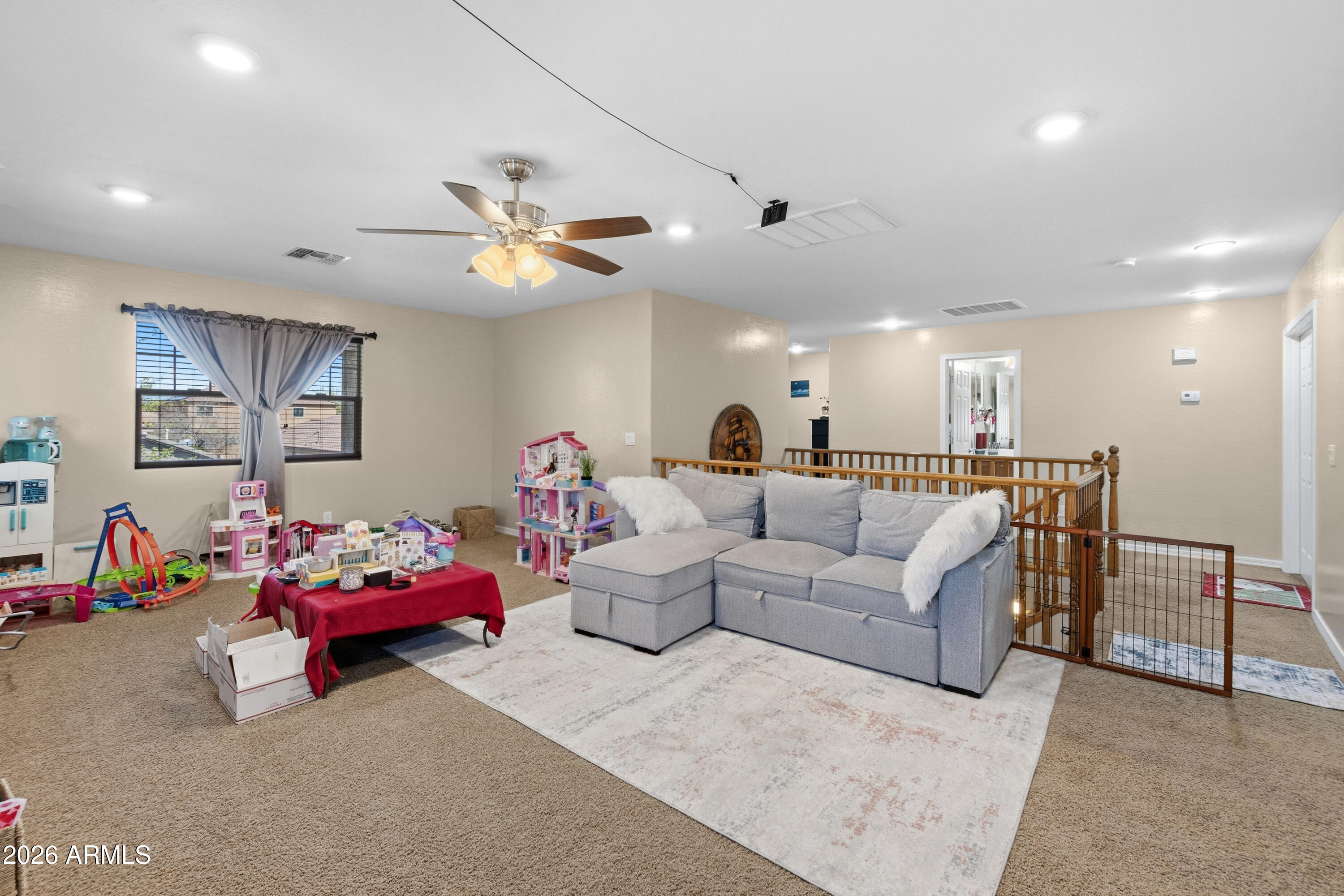 7639 West Georgetown Way Florence, AZ 85132 - Photo 11 of 25 a living room with furniture and a chandelier