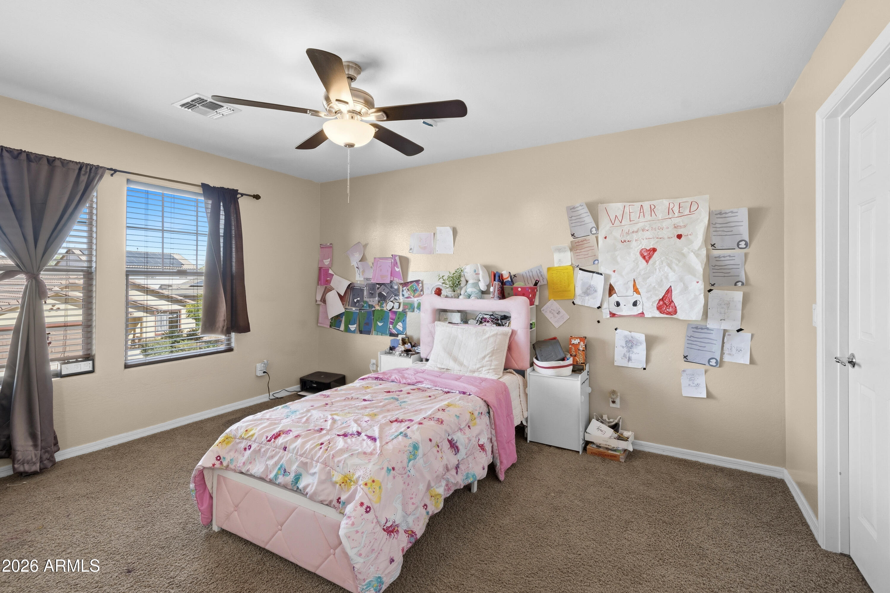 7639 West Georgetown Way Florence, AZ 85132 - Photo 16 of 25 a bedroom with bed and window